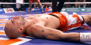 Mundine lies unconscious on the canvas after being knocked out by Sven Ottke in 2001.