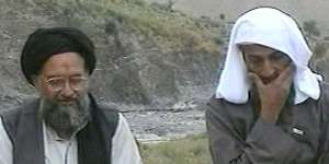 Osama bin Laden,right,listens as his top deputy Ayman al-Zawahri speaks at an undisclosed location,in this image made from an undated video broadcast in 2002.