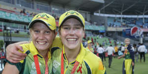 Ellyse Perry and Alyssa Healy celebrate after the team wins against England in the final of the ICC World Twenty20 in Bangladesh in 2014.
