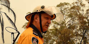 RFS official John Koole inspects a burnt-out home and out-building near Balmoral. 