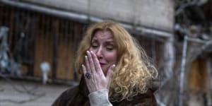 Natali Sevriukova outside her Kyiv apartment block following a rocket attack on Friday. 