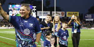 Royce Simmons enters BlueBet Stadium before the match following his 300km walk for dementia awareness.
