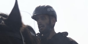 Israeli police deploy horses and stun grenades to disperse Israelis blocking a main road to protest against plans by Prime Minister Benjamin Netanyahu’s new government to overhaul the judicial system,in Tel Aviv.