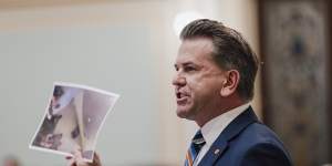 Deputy Premier Jarrod Bleijie tables photos purporting to show former premier Steven Miles drinking red wine in the Qantas Club at Townsville Airport.