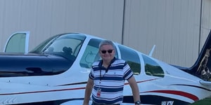 Pilot David Stephens with his 1966 Beechcraft Debonair plane.