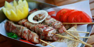 Excellent smoky pork skewers are hot off the grill.