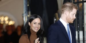 Britain's Prince Harry and Meghan,Duchess of Sussex,leave after visiting Canada House in London.