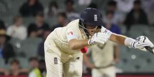 Joe Root is hit by a ball from Mitchell Starc.
