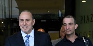 Hillsong founder Brian Houston (left) leaves Downing Centre Local Court on Monday.