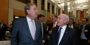 Former treasurer Peter Costello and former prime minister John Howard celebrate the 20th anniversary of Howard's 1996 election victory.