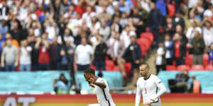 England’s Raheem Sterling,left,and Luke Shaw take the knee during the Euro 2020 match between England and Germany at Wembley Stadium in London in June.