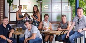 Vaucluse trainer Mike Webster (front centre) with Bobby the shelter dog. The Strut with Mutts is a chance for the dogs to escape the cage and raise money for the Animal Welfare League. 