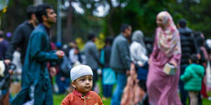 A child enjoys the festivities after Eid prayers at Flagstaff Gardens. 