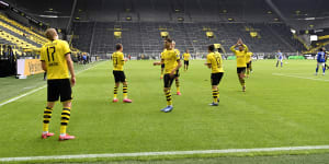 Erling Haaland and his teammates celebrate his opener for Dortmund - from a distance.