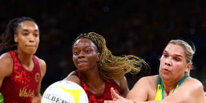 Funmi Fadoju of England and Donnell Wallam of Australia compete for the ball.