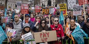 Education workers rally for higher pay in London.