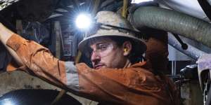 A worker operates the tunnel boring machine known as Kathleen,on the Sydney Metro tunnel.