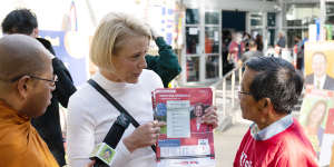 Labor candidate Kristina Keneally handing out how-to-vote cards in Fowler.