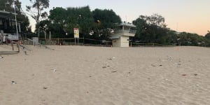 Noosa's Main Beach was littered with rubbish,including broken glass,on Sunday after a Schoolies party the night before.