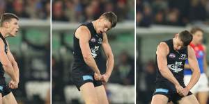 Carlton’s Sam Walsh flexes his muscles after kicking the Blues’ first goal against Melbourne on Thursday night.