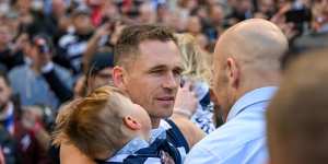 Joel Selwood takes great mate Gary Ablett jnr’s son Levi out on to the field with him.