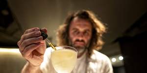 Co-owner of 61st ranked Melbourne bar Byrdi Luke Whearty makes a martini.