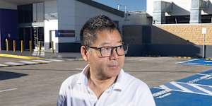 Harry Li,who runs a shopfitting business in Lansvale,charges his BYD Shark at an EV charging station at Merrylands. Parts of Sydney are lagging in charging infrastructure as EV sales boom in the wake of high fuel prices. 