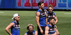 The Western Bulldogs warm up prior to a training session in Perth.