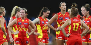 The look on their faces says it all:The Gold Coast Suns after their draw against the Western Bulldogs.