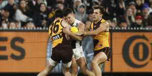 Rugged night:Nick Daicos collided with James Blanck and was hurt after this third term incident.