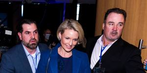 Katherine Deves is escorted from a NSW Liberals function last month. 