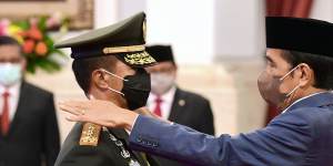 Indonesian President Joko Widodo,right,inaugurates the new Armed Forces Chief General Andika Perkasa,in November. He will be watching China’s military moves in the South China Sea closely.