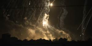 Smoke and flares rise over Gaza City during an Israeli strike in the Gaza Strip,as seen from southern Israel.