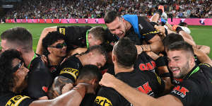 Penrith players celebrate their first premiership in 18 years.