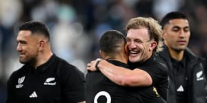 Damian McKenzie and Aaron Smith celebrate a comprehensive New Zealand win in Paris.