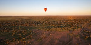 The view from above – hot-air ballooning and the spectacular dawn colours of the MacDonnell Ranges.