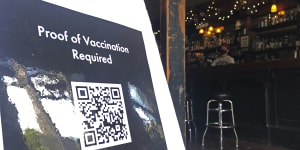 A proof of vaccination sign is posted at a bar in San Francisco on Thursday,July 29,2021.