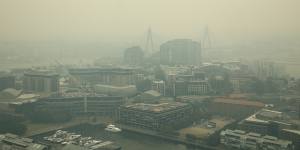 Smoke envelops the city after another day of bushfires on Thursday.