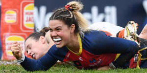 Adelaide’s Anne Hatchard celebrates a goal.