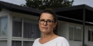 Lisa Woodall pictured in front of her late parents’ house.