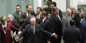 Prime minister John Howard and parliamentary staff prevent Greens senators Kerry Nettle (third from left) and Bob Brown (behind her) from approaching president George W. Bush (far right) on October 23,2003.