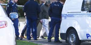 Police arrest a man,believed to be aged 37,at a block of units in Dee Why.