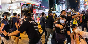 Undercover police arrest attendees of a memorial vigil for the victims of Tiananmen Square in Mongkok,Hong Kong,on Thursday.