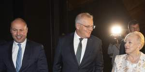 Former treasurer Josh Frydenberg and then-prime minister Scott Morrison with Karyn Sobels in 2021.