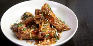 Finger lickin'twice-cooked,sweet and sour pork ribs with palm sugar and tamarind. 