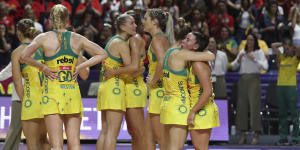 Australia's players stand on court after losing the Netball World Cup final to New Zealand.