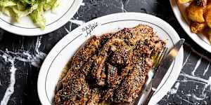 Thick,bone-in lamb chops are braised overnight in lamb stock.