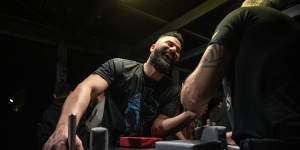 Sydney Spartans Armwrestling Club president Oz Caglar hosts weekly training sessions the backyard of his home in North Rocks.