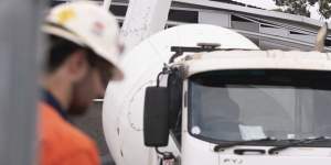 Workers fill in the huge sinkhole with cement in March to stabilise a two-storey building which teetered on the edge.