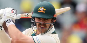 Travis Head carves a boundary on day two in Adelaide.